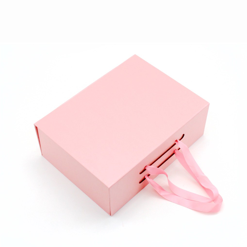 Pink magnetic gift box with ribbon carrying handle